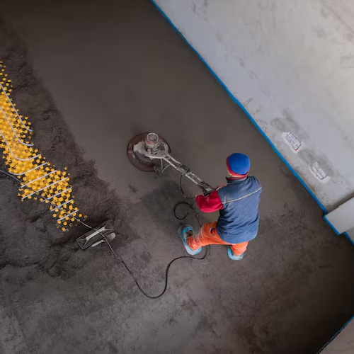 Floor screeding contractors levelling a subfloor before tiling