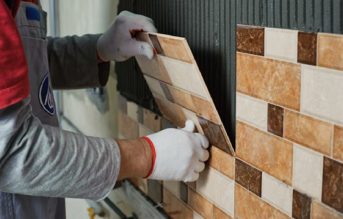 Professional tilers installing tiles for a home renovation